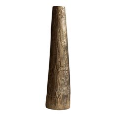 a tall wooden vase sitting on top of a table