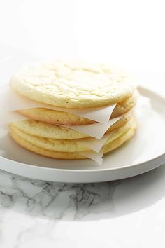 a stack of cookies sitting on top of a white plate