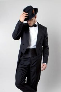 There is nothing that outdoes the formal look of this black tail tuxedo jacket. It features the classic non-closing front with satin buttons for decoration. Peak lapels are faced in satin for an elegant look. The back of the jacket is unadorned and the tails reach past the knee. Pants are flat front with a tapered cut and have a satin side seam stripe, and there are pockets in the front and back. #menssuits #menssuit #menstuxedo #tuxedo #weddingformal #weddingsuits #flexsuits Tailcoat Tuxedo, Tuxedo With Tails, Vintage Tuxedo, Tuxedo Coat, Black Patent Shoes, Female Cop, Classic Tuxedo, Knee Pants, Slim Fit Tuxedo