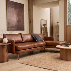 a living room filled with furniture and a large mirror