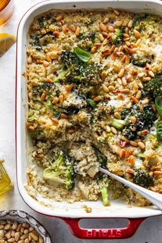 a casserole dish filled with broccoli and nuts