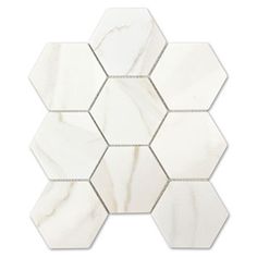 white marble hexagon tiles with silver dots