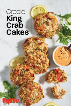 crab cakes on a plate with dipping sauce