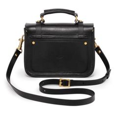 A vintage inspired shape reimagined with your lifestyle in mind, the Alder Mini Satchel is sure to be your new go-to daily bag! The front push-lock flap keeps your essentials well secured while wearing it on the shoulder or by the top handle. | Old Trend Alder Mini Satchel, Black Classic Satchel With Hasp Closure, Chic Satchel With Brass Hardware For Travel, Classic Flap Bag With Detachable Strap For Everyday Use, Chic Travel Satchel With Brass Hardware, Classic Satchel Saddle Bag With Metal Hardware, Retro Everyday Satchel With Gold-tone Hardware, Timeless Travel Satchel With Metal Hardware, Everyday Flap Satchel With Hasp Closure, Classic Saddle Bag Satchel With Metal Hardware