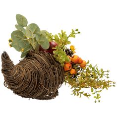 an arrangement of flowers and fruit in a wicker basket with leaves on white background