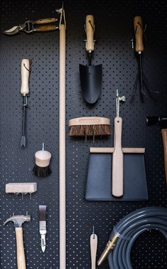 there are many tools on the pegboard and it is hard to tell what they are