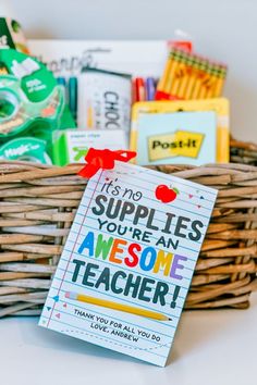 a teacher appreciation card in a basket with school supplies on the side and a note attached to it