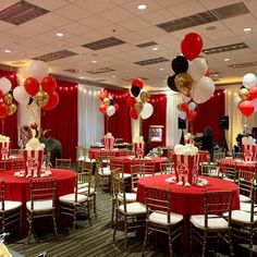 a banquet hall decorated with red and white balloons