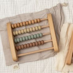 an abacusk is sitting on top of a blanket next to a wooden spoon