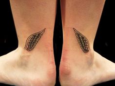 two feet with tattoos on them, one has an angel wing and the other has a cross