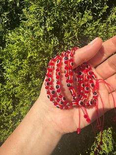 Red adjustable evil eye bracelet Red Beaded Evil Eye Bracelet With Round Beads, Trendy Red Bracelet For Festival, Adjustable Red Evil Eye Bracelet, Hand-strung, Adjustable Red Evil Eye Bracelet Hand-strung, Handmade Red Evil Eye Bracelet For Festival, Trendy Resizable Evil Eye Bracelet, Adjustable Red Evil Eye Friendship Bracelets, Adjustable Evil Eye Beaded Bracelet, Casual Adjustable Evil Eye Bracelet With Round Beads