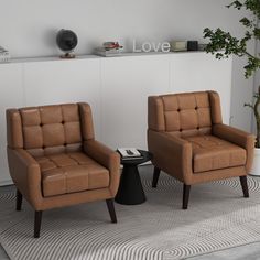 two brown chairs sitting next to each other on top of a carpeted room floor