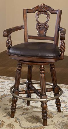 a wooden chair sitting on top of a rug