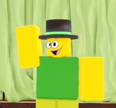 a lego man wearing a top hat and green shirt with yellow blocks in front of him