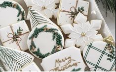 christmas cookies decorated with green and white decorations