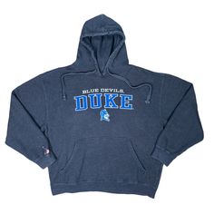 Vintage Y2K Knights Apparel Duke University Blue Devils Hoodie Pullover Good vintage condition*  Size XL  Pit to pit 26"  Shoulders 26"  Length 26" Hem 22"  Sleeves 24"  *Gray drawstring hoodie pullover  *Duke Blue Devils embroidered spell-out / logo on front  *Blank back  *on the Knights Apparel tag  *Kangaroo pockets  *60% cotton, 40% polyester  *Machine washable  *bleach mark on sleeve (pictured) University Hoodies, 90s Hoodie, Patchwork Hoodie, Duke Blue Devils, Duke University, College Hoodies, College Sweatshirt, Blue Devil, Hoodie Pullover