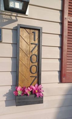 a wooden door that has flowers in it