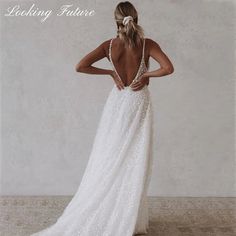 a woman in a wedding dress looking back