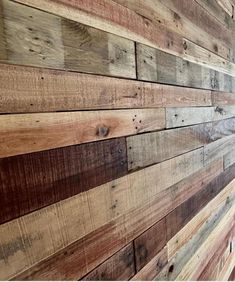 the side of a wooden wall made out of wood planks