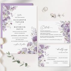 wedding stationery with purple flowers and greenery