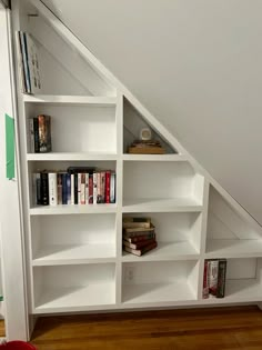 there is a book shelf in the corner of this room