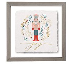 an art print with the word joy written in gold on it and a nutcracker