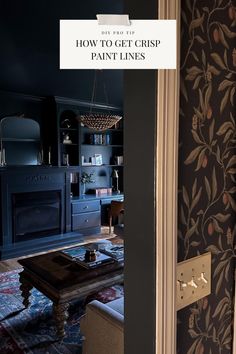 an open door leading to a living room with black walls and floral wallpaper on the walls