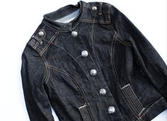 "This vintage dark denim military jacket is another fun Y2K piece that remains timeless! - large military silver button details - has 2 pockets Fit/Size: XS (looks like a juniors size) this could fit a petite woman or older child, please see measurements Condition: GREAT preloved condition.  All of my sustainable pieces are prewashed or dry cleaned and are coming from a pet free, smoke free environment. Material: 98% Cotton, 2% Spandex *Measurements: (Measured flat and doubled) Length: 20\" Bust: 32\" Waist: 30\" <> Rest assure that ALL of our items are washed or dry cleaned and coming from a pet free, smoke free environment! Keep in mind that with vintage and secondhand items, there will be normal wear, but we will do our absolute best to always list any flaws with all of our items. <> Al Fitted Utility Denim Jacket With Buttons, Dark Wash Button-up Denim Jacket With Pockets, Cheap Dark Wash Button-up Denim Jacket, Vintage Dark Wash Button-up Denim Jacket, Pre-washed Dark Wash Denim Jacket, Petite Woman, Vintage Dark Wash Single-breasted Denim Jacket, Dark Denim Jeans, Silver Buttons