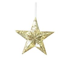 a gold star ornament hanging from a string