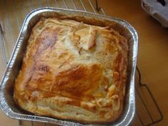 a loaf of bread sitting on top of a metal pan