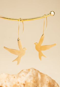 Freedom Takes Flight! These beautiful earrings, crafted in gleaming 14k plated gold, feature a delicate dove suspended from a hypoallergenic french hook. The dove, a universal symbol of peace and freedom, takes flight with every step you take. It soars with hope you inspire. Your purchase helps survivors of human trafficking and exploitation experience freedom, establish independence, and develop life-transforming careers. empowers women seeking a brighter future.  Box size and color may vary. Symbol Of Peace, The Dove, August Birthstone Jewelry, July Birthstone Jewelry, Zodiac Jewelry, Gifts For New Mums, Jewelry Ring Box, Pearl Jewellery Earrings, Men's Jewelry Rings