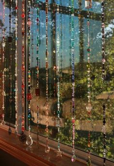 a window with beads hanging from it's side