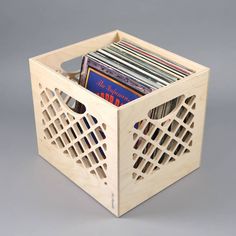 a wooden box that has cd's in it