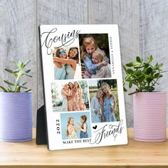 a photo frame with four photos on it next to two potted plants