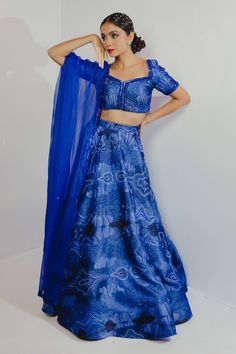 Electric blue lehenga with abstract print and cutdana, sequin embroidery. Paired with blouse and dupatta.
Component: 3
Pattern: Printed, Embroidery
Type Of Work: Abstract, sequin, cutdana
Neckline: V neck
Sleeve Type: Half
Fabric: Imported Satin, Organza
Color: Blue
Other Details: 
Back deep V neck
Sheer dupatta
Occasion: Wedding - Aza Fashions Blue Party Wear Choli With Traditional Drape, Traditional Blue Choli For Evening, Blue Bollywood Embellished Pre-draped Saree, Traditional Blue Pre-draped Saree With Sequins, Blue Pre-draped Saree For Festive Party Wear, Traditional Blue Sequined Pre-draped Saree, Blue Sequined Party Wear Sets, Blue Sequined Floor-length Pre-draped Saree, Festive Blue Embellished Pre-draped Saree