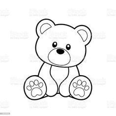 a black and white teddy bear with paw prints on it's chest, sitting down