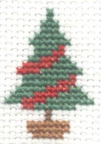 a cross - stitch christmas tree with red and green leaves on it's top