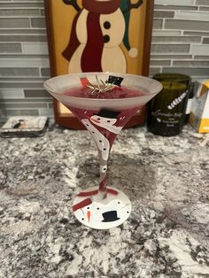 a martini glass sitting on top of a counter