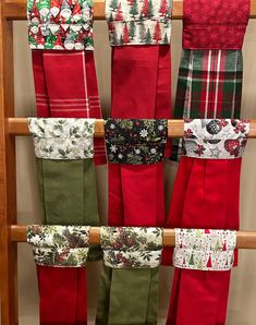 christmas stockings hanging up on a wooden rack