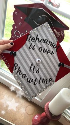 someone is holding up a graduation cap that says, reheana is over it's showtime