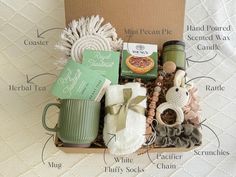 the contents of a coffee gift box on a bed with labels and instructions for each item