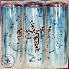 three blue tumbles with the words faith and a cross painted on them