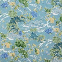 an upholstered blue fabric with green and yellow flowers on the side, all over