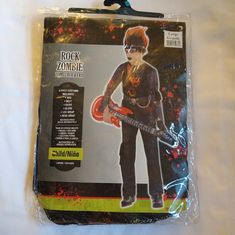 the package is packaged in plastic and has an image of a young boy holding a guitar