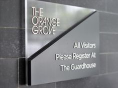 the orange grove all visitors sign on the wall