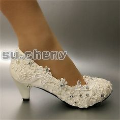 white bridal shoes with beading and pearls