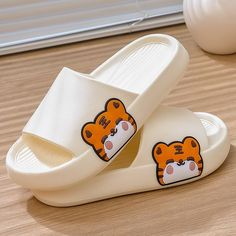 The Tiger Slides have cute, cartoon tigers on each variation! The EVA slides are comfortable and perfect for any age and gender. The white slide makes the orange tiger pop. They are fantastic for animal and tiger lovers everywhere! FEATURES: Style Open Toe Season Summer/ Spring Sole Flat Vamp material EVA COMFORTABLE MATERIAL: The Tiger Slippers are made of high-density material. These are light, soft, breathable, and waterproof, and their excellent flexibility and durability make them perfect for everyday wear. The modern features and attractive characteristics will never go out of style even if worn for years. SUPER NON-SLIP SOLE: The super comfy footwear features a thickened sole with an anti-slip texture design that provides excellent friction and just the right amount of support as yo White Slide Flip Flops For Leisure, White Flat Slides For Leisure, Cute White Slippers For Leisure, Orange Non-slip Casual Slippers, Playful White Open Toe Flip Flops, Casual Orange Flat Slides, Playful White Flat Slippers, Playful White Synthetic Slippers, Playful White Slip-on Sandals