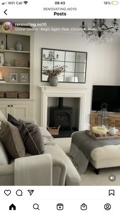 a living room filled with furniture and a fire place in front of a tv mounted on a wall