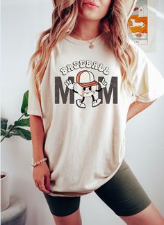 Sporty Graphic Print T-shirt For Mother's Day, Funny White Sublimation T-shirt With Graphic Print, Casual Sublimation Print T-shirt For Mother's Day, White Graphic Print Transfers For Sports Events, Casual Sublimation Design T-shirt With Custom White Print, White Casual Sublimation Tee With Letter Print, Casual White Sublimation Top With Letter Print, Casual Sublimation T-shirt With Graphic Print Fan Merchandise, Casual T-shirt With Sublimation Print For Mother's Day