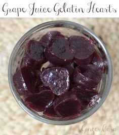 a jar filled with beets sitting on top of a table